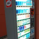 日本街头一台亮着灯的香烟自动售货机，侧面面板上还贴着旧的taspo办卡通知