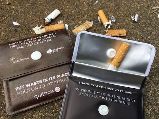 Pocket ashtray being opened to deposit a cigarette butt